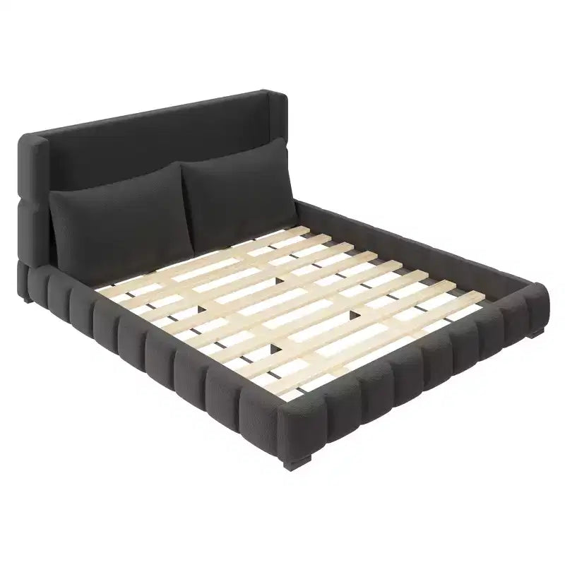 Lit plateforme rembourré avec 2 oreillers